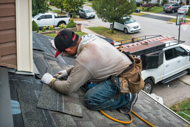 Professional Roofing technician working in Peosta, IA